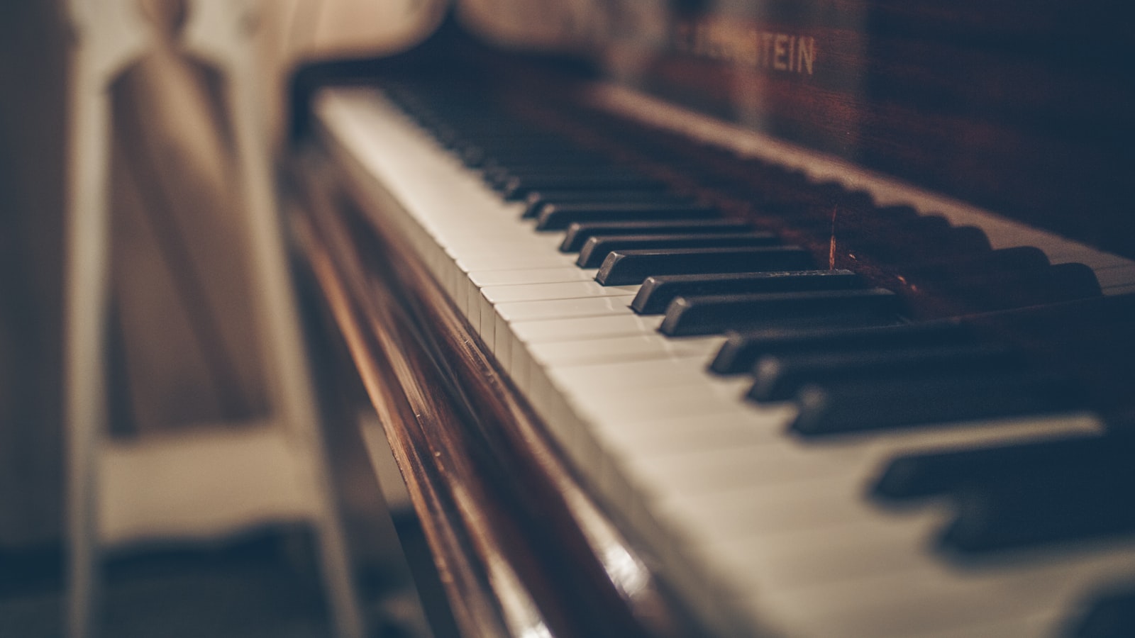 A close-up of the black and white keys of a piano.